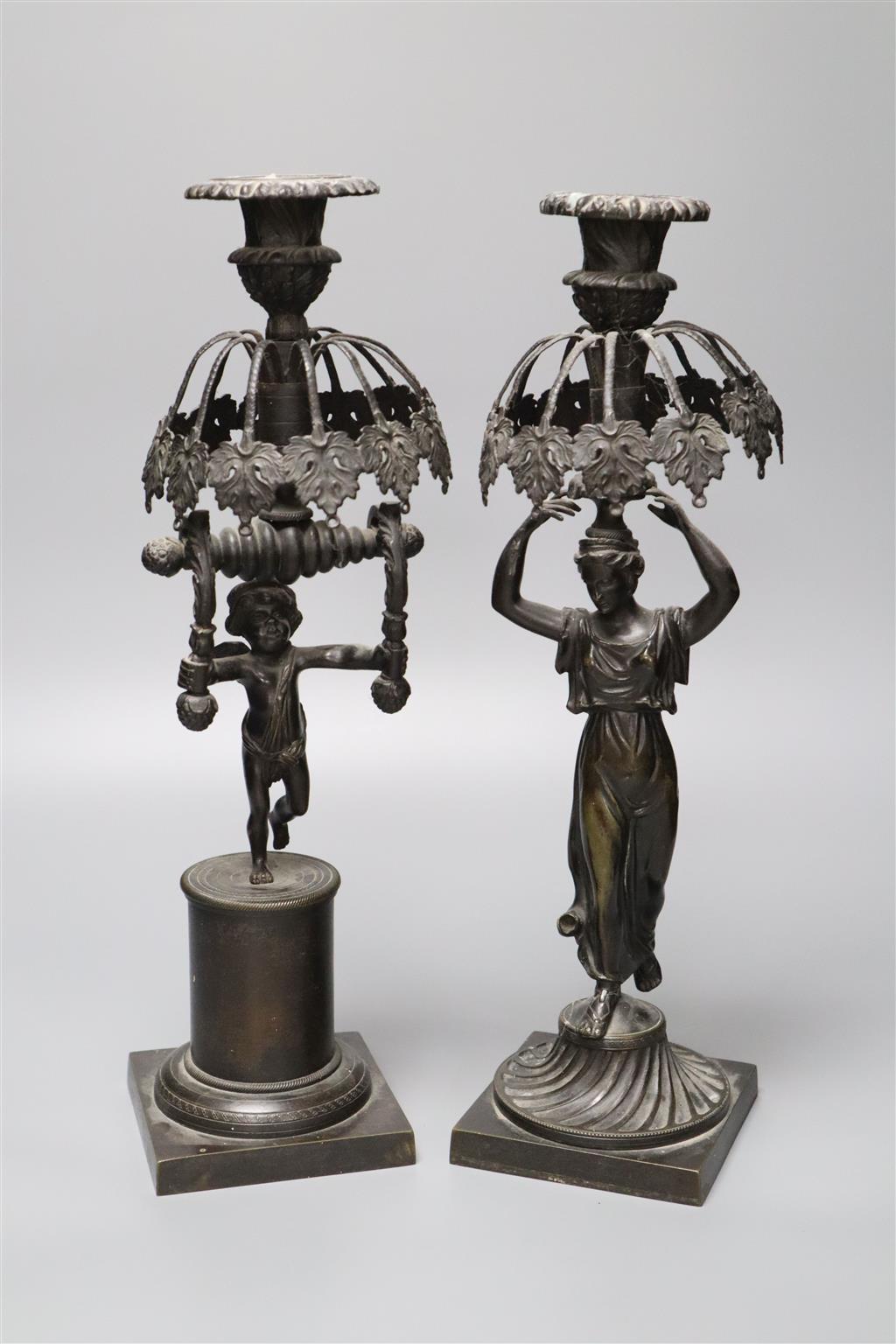 Two early 19th century bronze figural candlesticks (lacking glass lustres), 37.5cm